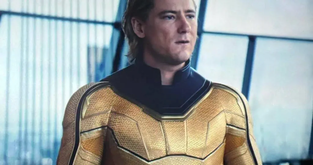 A character wearing a golden superhero costume with a textured design and a serious expression.