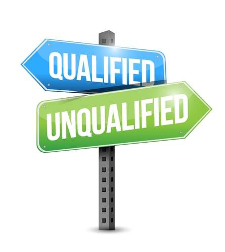 A directional sign featuring two arrows labeled 'Qualified' in blue and 'Unqualified' in green.