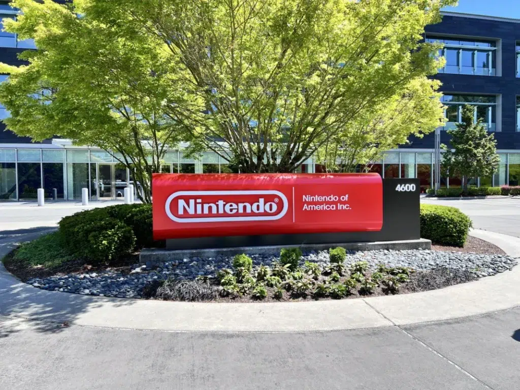 Red sign displaying the Nintendo logo and company name at the Nintendo of America headquarters.