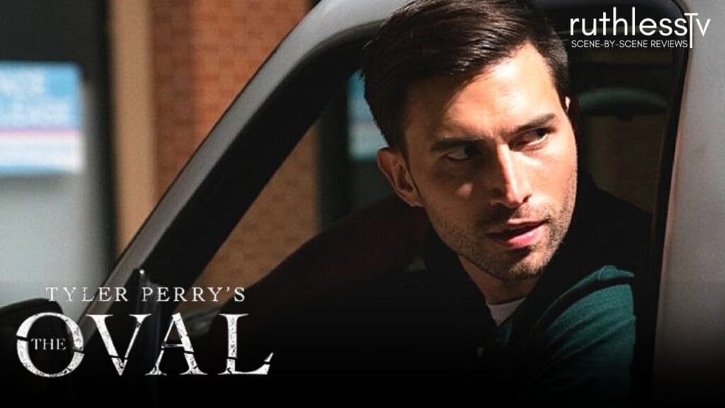 A character from Tyler Perry's The Oval looking out from a vehicle with a serious expression.