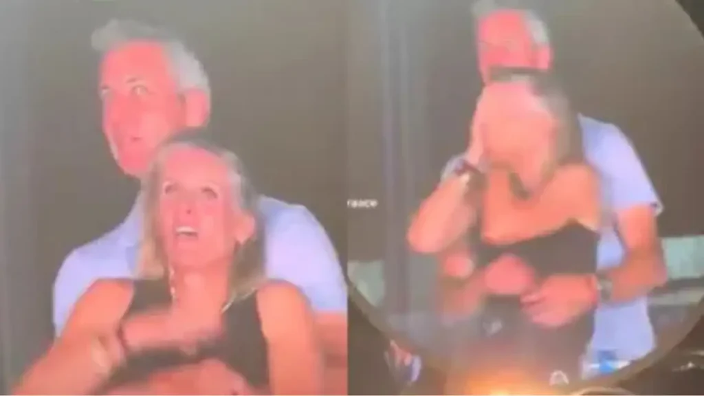 A couple sharing a moment, with the man standing behind the woman, both appearing surprised or amused.