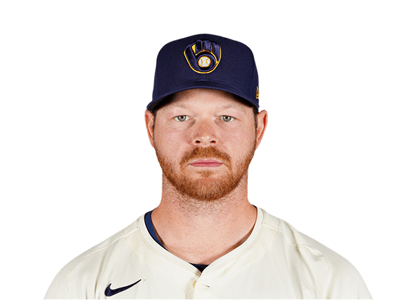 Baseball player wearing a team jersey and cap, looking directly at the camera.